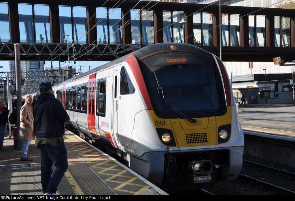 Easing into the station for its stop